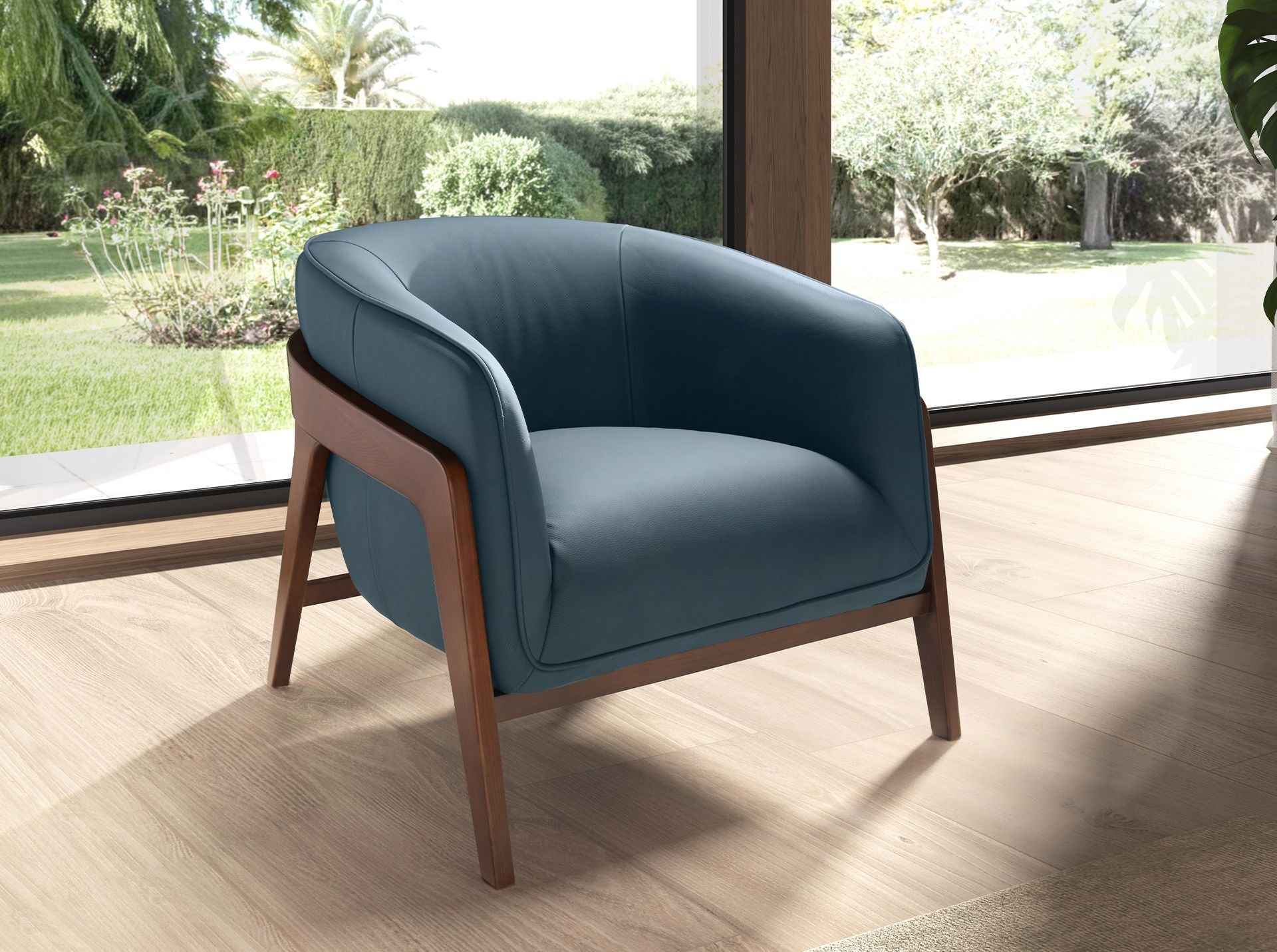 Poltrona in pelle blu petrolio