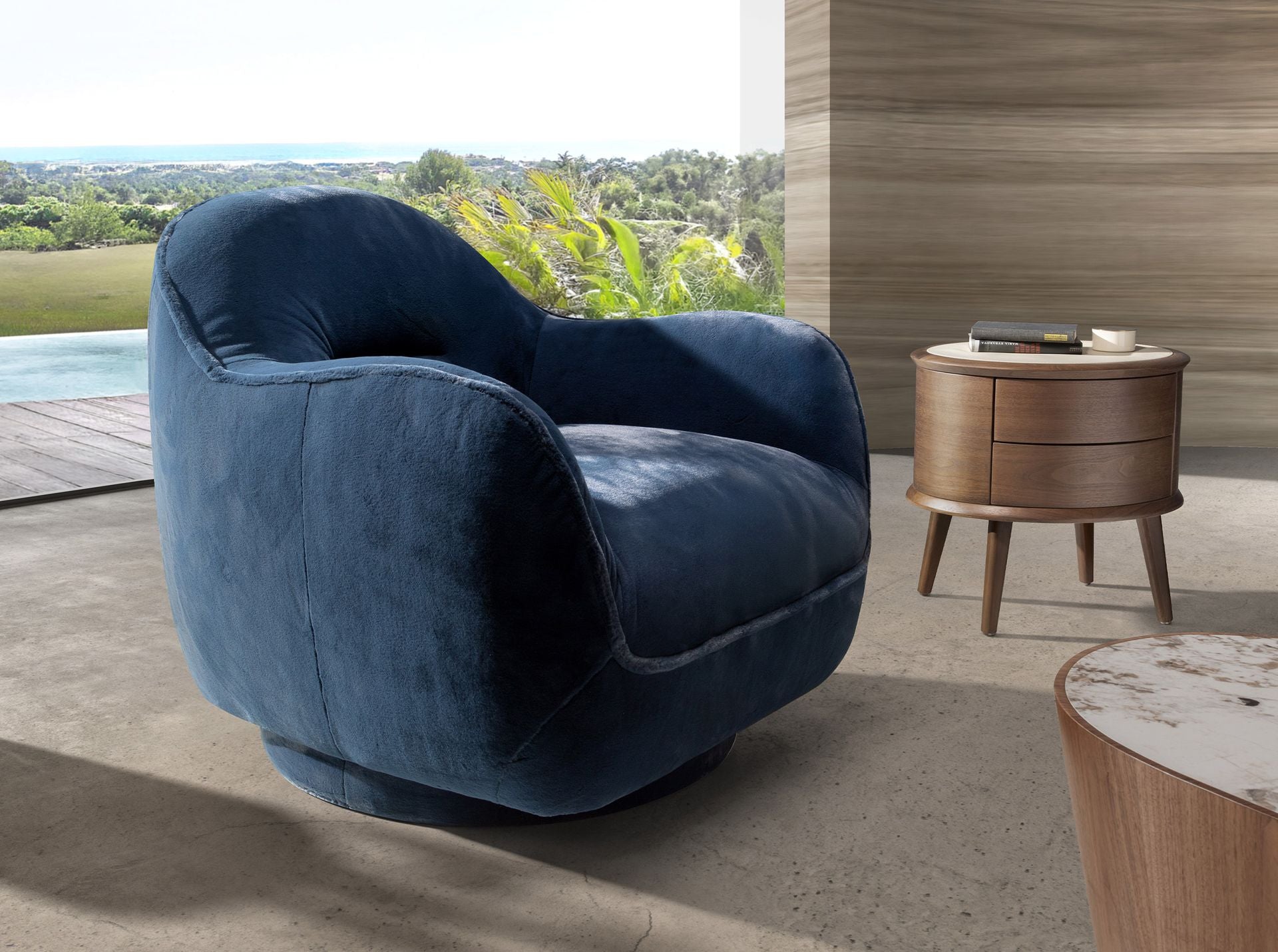 Poltrona girevole in velluto blu scuro